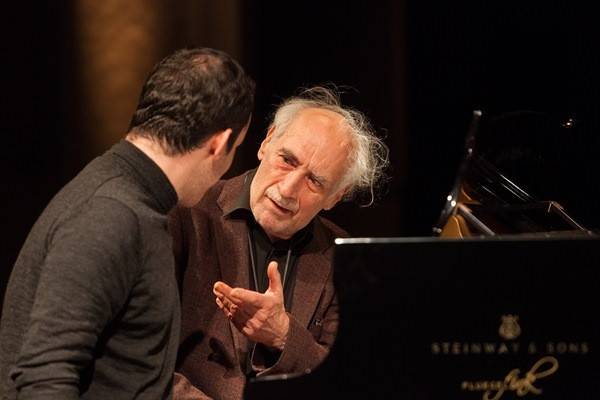 Igor Levit talking with fellow pianist