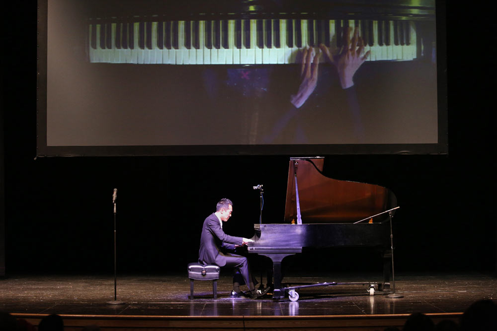 Alpin Hong on stage playing piano