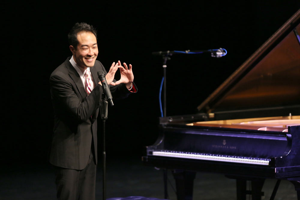 Alpin Hong speaking on stage