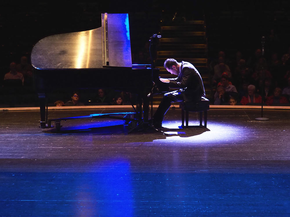 Alpin Hong playing the piano on stage