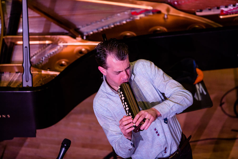 gentleman playing instrument on stage