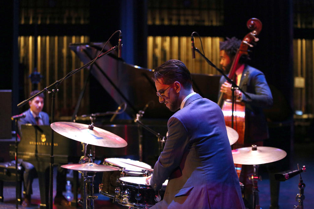 Emmet Cohen Trio performing on stage