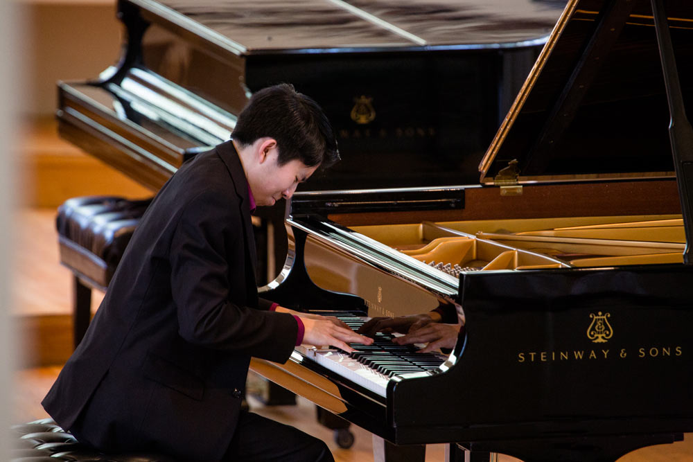Elliot Wuu playing the piano