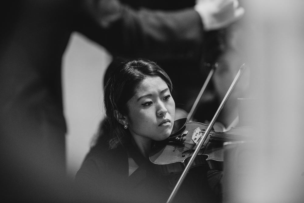 close up of woman playing the violin