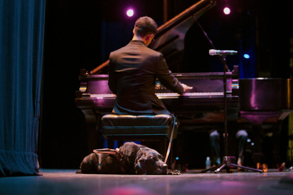 Justin Kauflin playing piano on stage