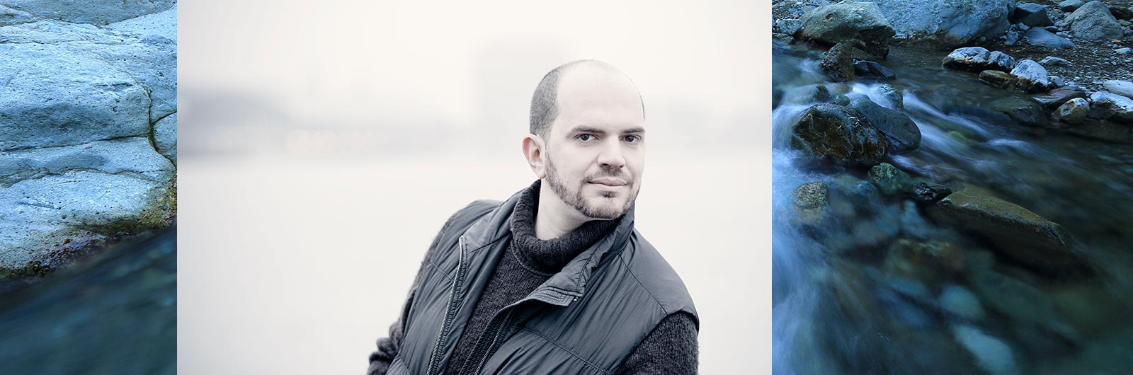kirill gerstein portrait, rocks in background