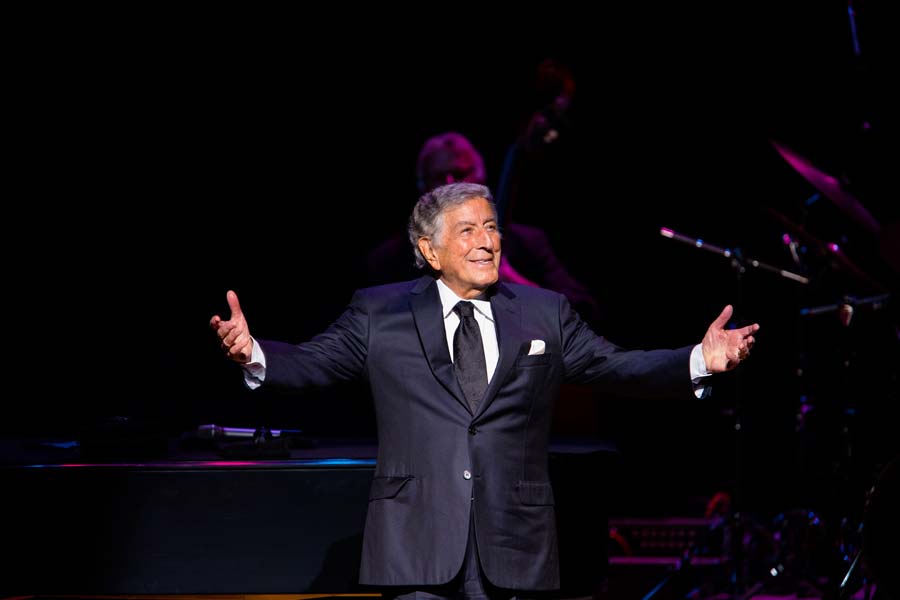 Tony Bennett with his arms outstretched
