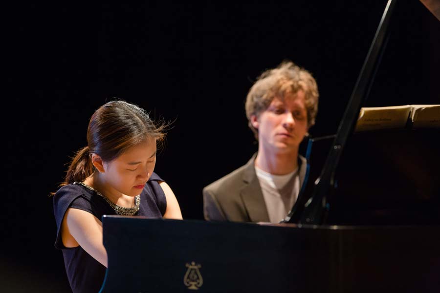 Rafal Blechacz looking on at a student during a master class