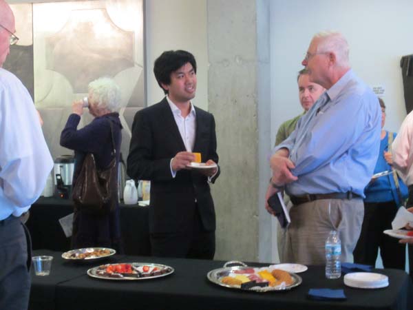 Sean Chen speaking with two gentlemen at his rising star reception