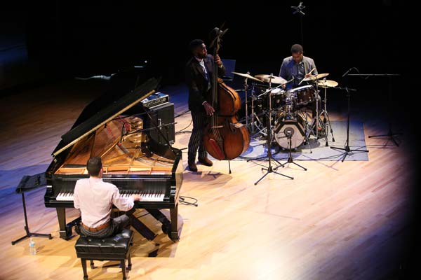 the Emmet Cohen Trio on stage together