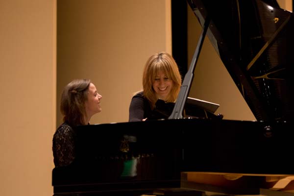 Ingrid Fliter and student playing the piano