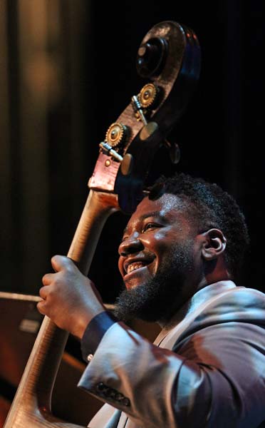 the Sullivan Fortner Trio's bassist smiling at the audience