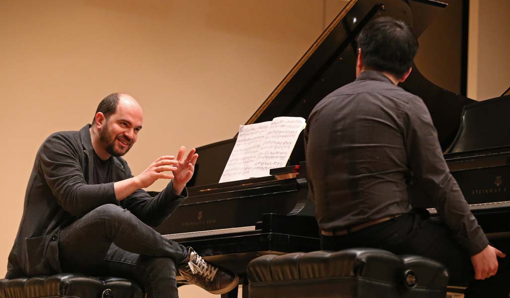 Kirill Gerstein conversing with a student during his master class
