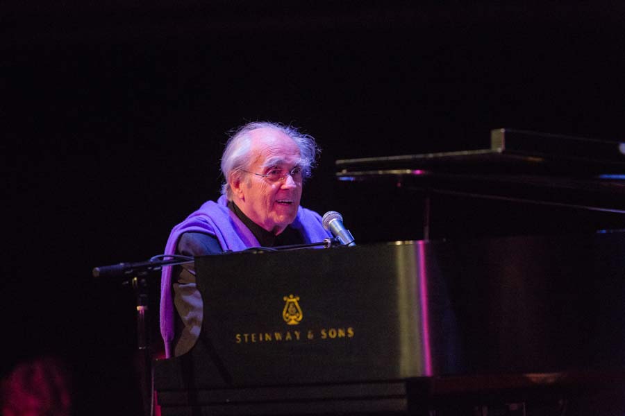 the Michel Legrand Trio's pianist looking to the audience