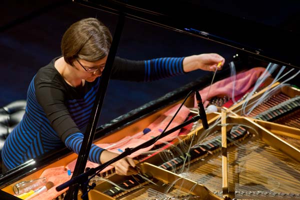 Barbara Lieurance preparing the piano