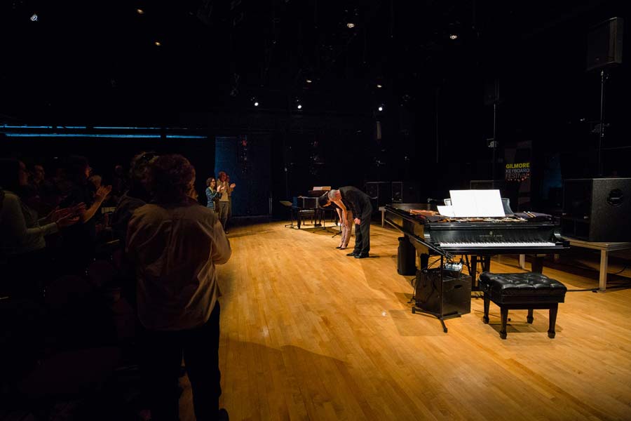 Karlheinz Stockhausen bowing before audience