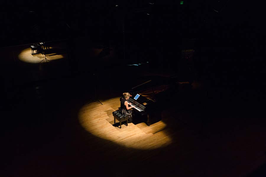 Lisa Moore playing the piano on stage