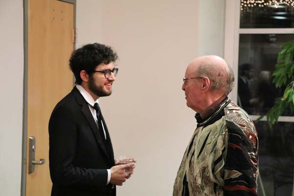 gentleman speaking with Roman Rabinovich