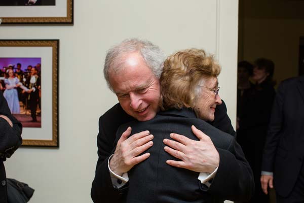 Sir András Schiff giving a woman a hug