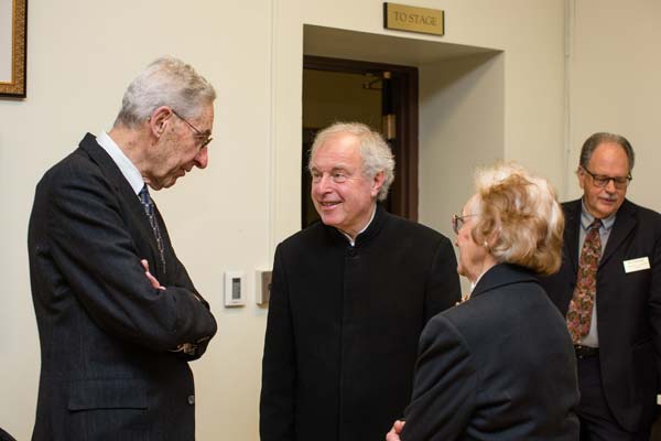 Sir András Schiff socializing with people