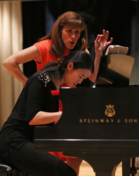 Lori Sims instructing a student during her master class