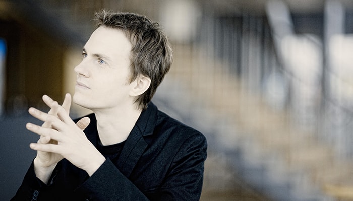 Alexandre Tharaud poses for a portrait looking off into the distance