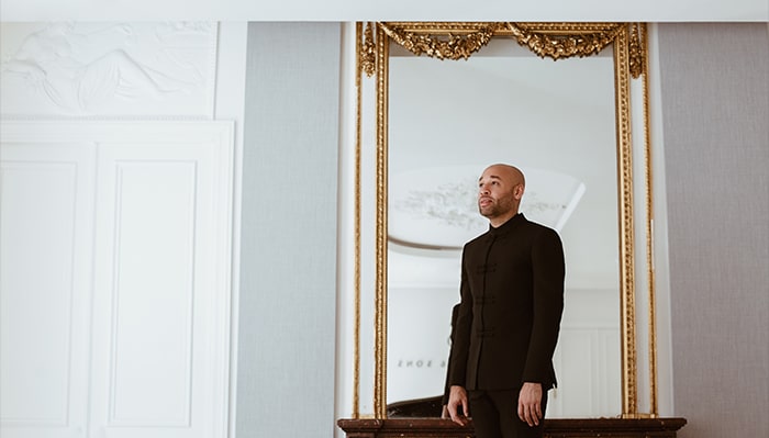 portrait of aaron diehl reflected in a white room
