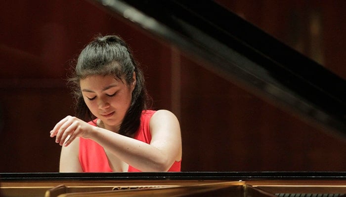 avery gagliano performs piano