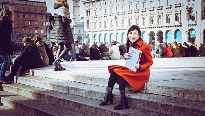 Rachel Naomi Kudo sits on steps for a portrait