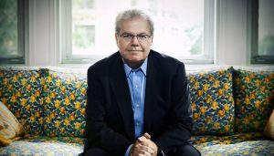 portrait of emanuel ax sitting on couch