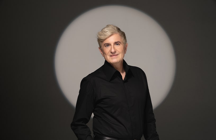 Jean-Yves Thibaudet poses for a portrait with a spotlight
