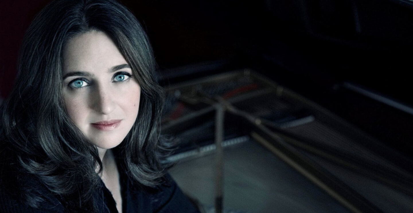 simone dinnerstein looks directly at the viewer in a portrait