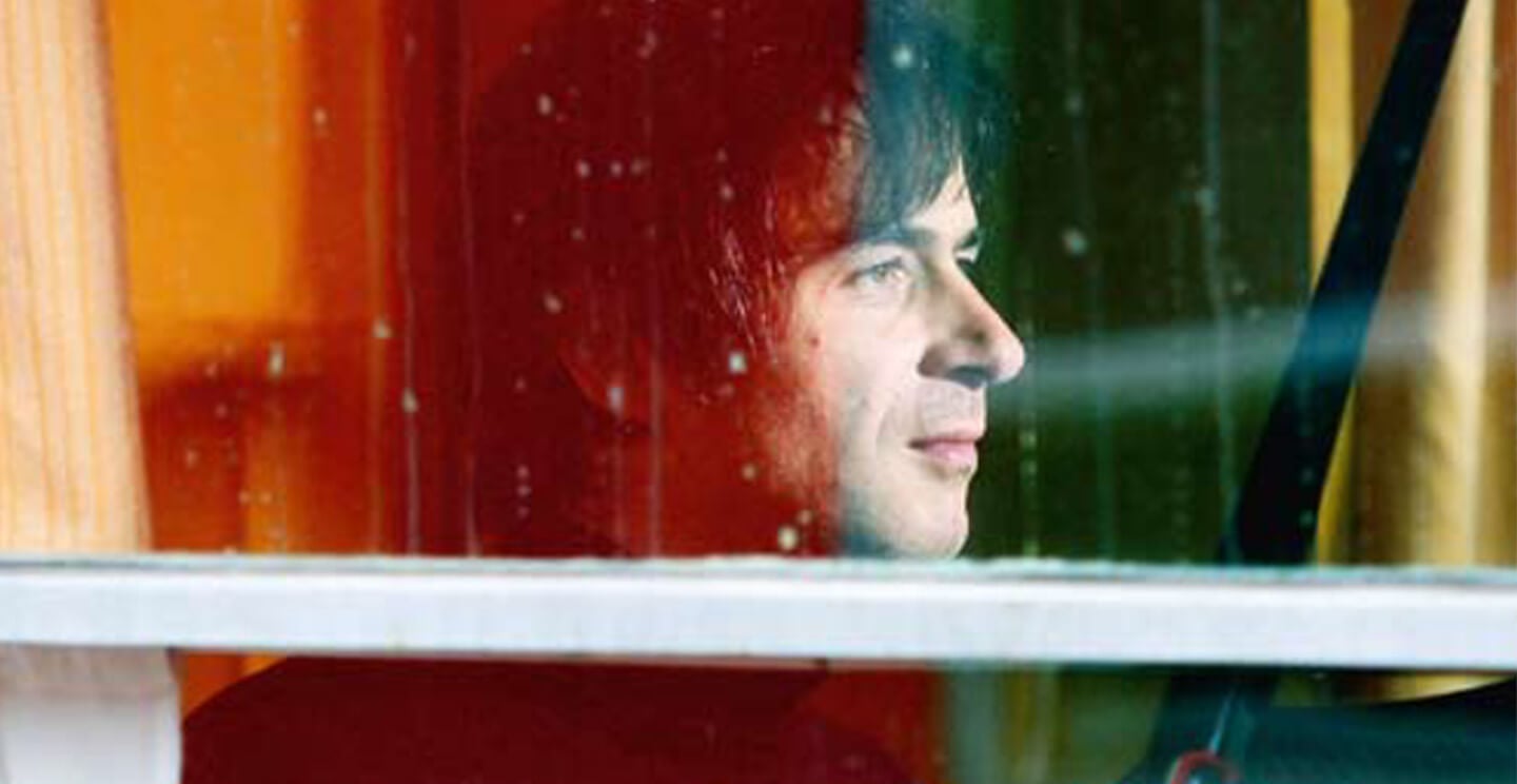 Piotr Anderszewski looks out through a window